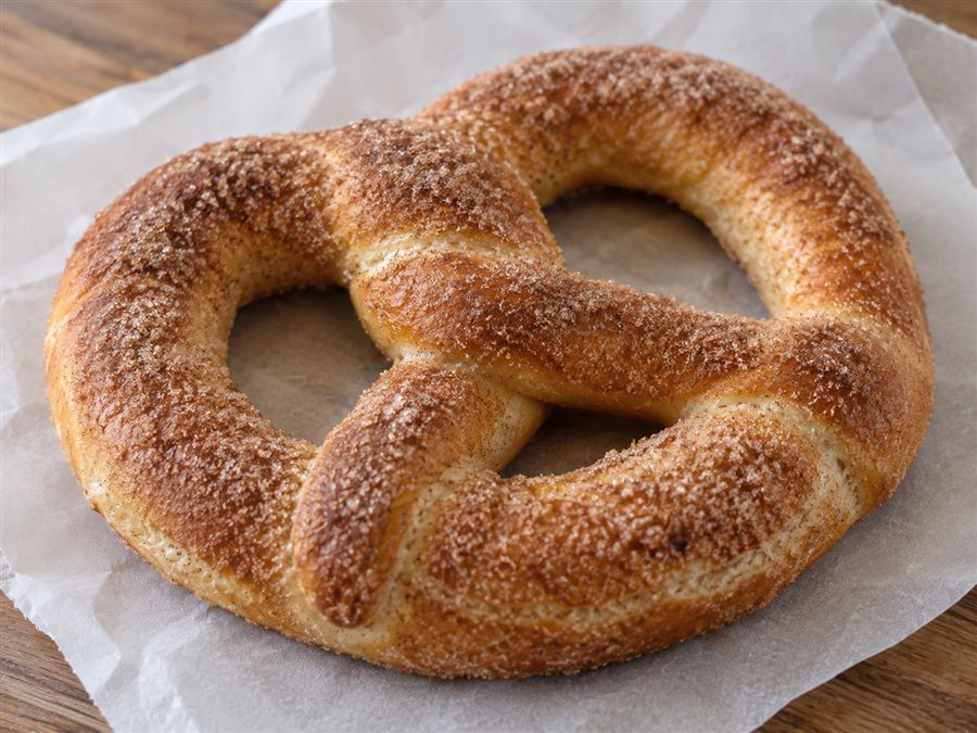 Soft pretzel coated in cinnamon sugar