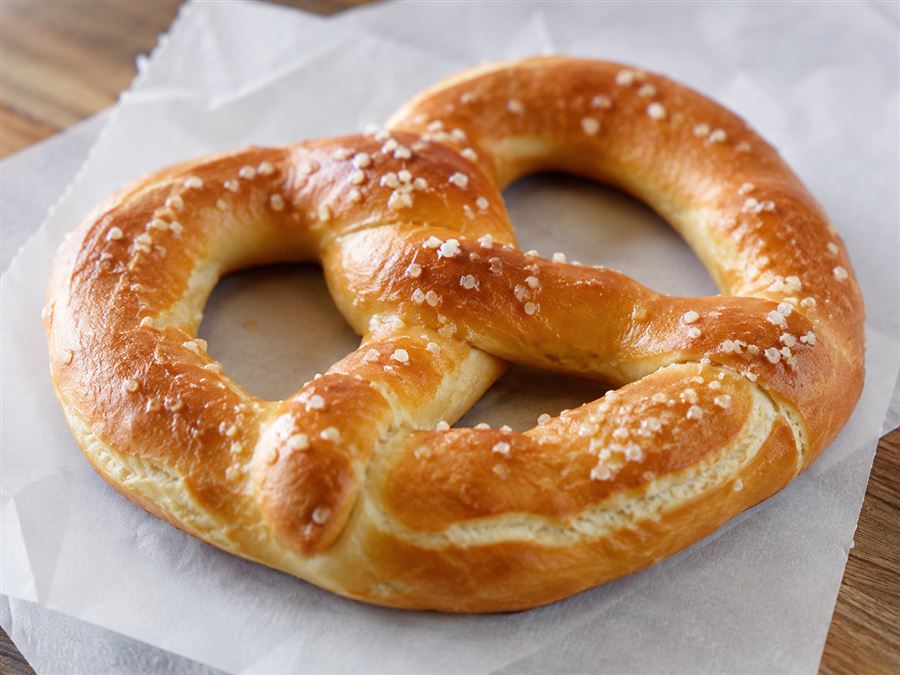 Golden classic soft pretzel topped with coarse salt